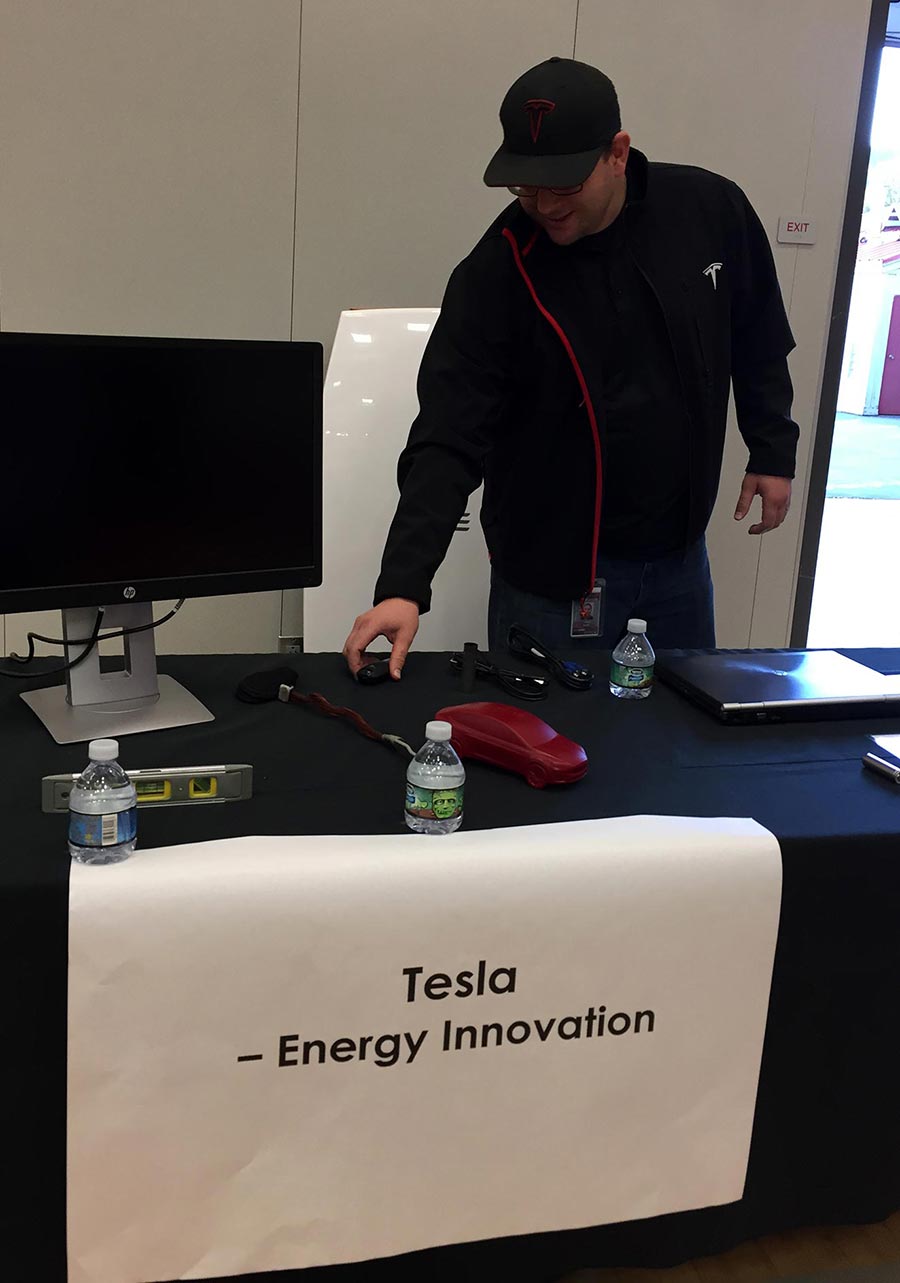 My colleague Adam standing behind our modest booth at the Truckee STEAM Fair (2016)